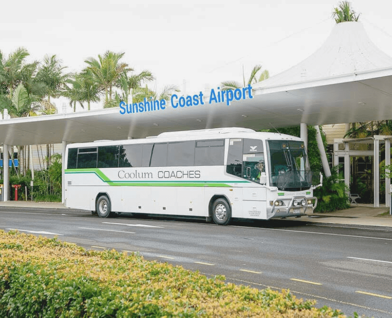 A coolum coaches airport transfer parked outside the sunshine coast airport