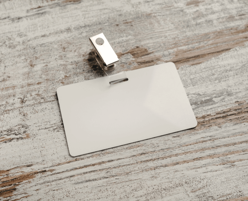 a blank plastic swipe card on a white-washed wooden table