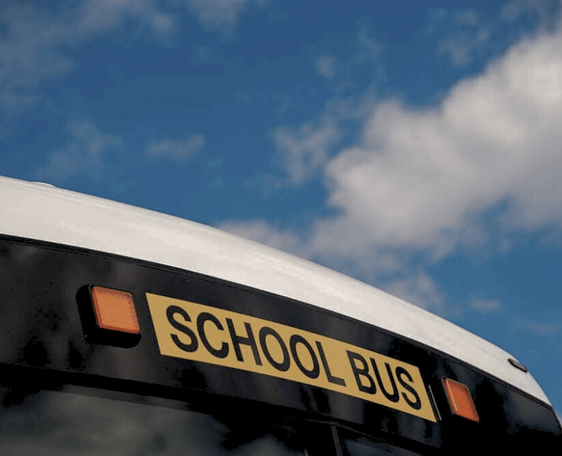 A close up of the front of a school bus on the sunshine coast